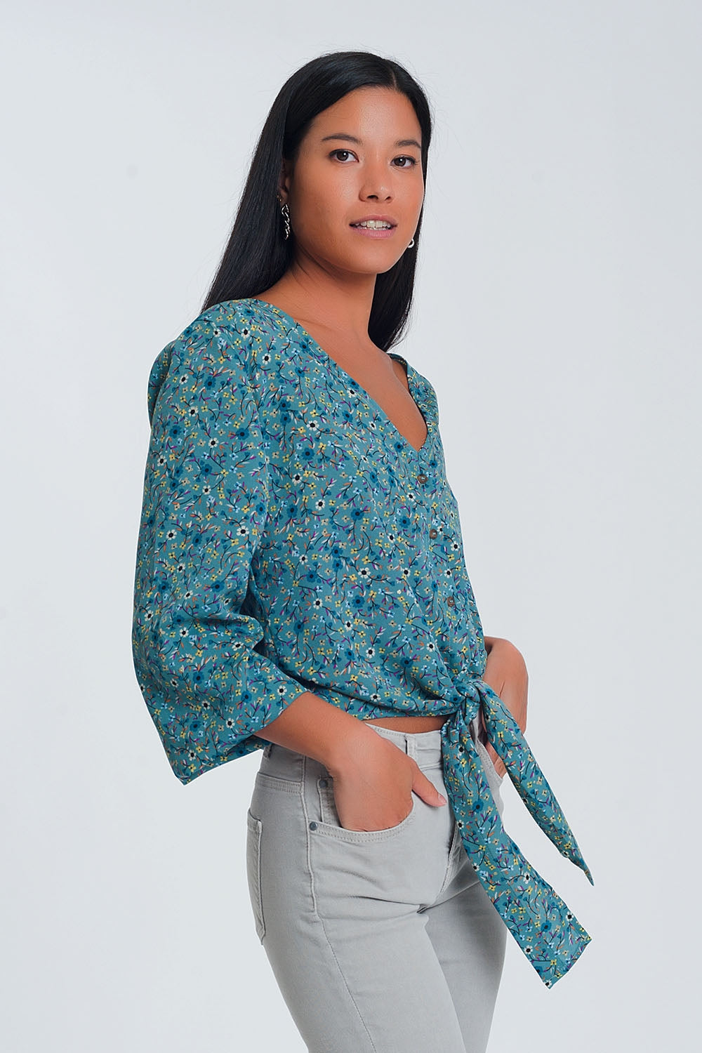 Blusa a maniche lunghe con scollo a V bottoni e stampa a fiori verde