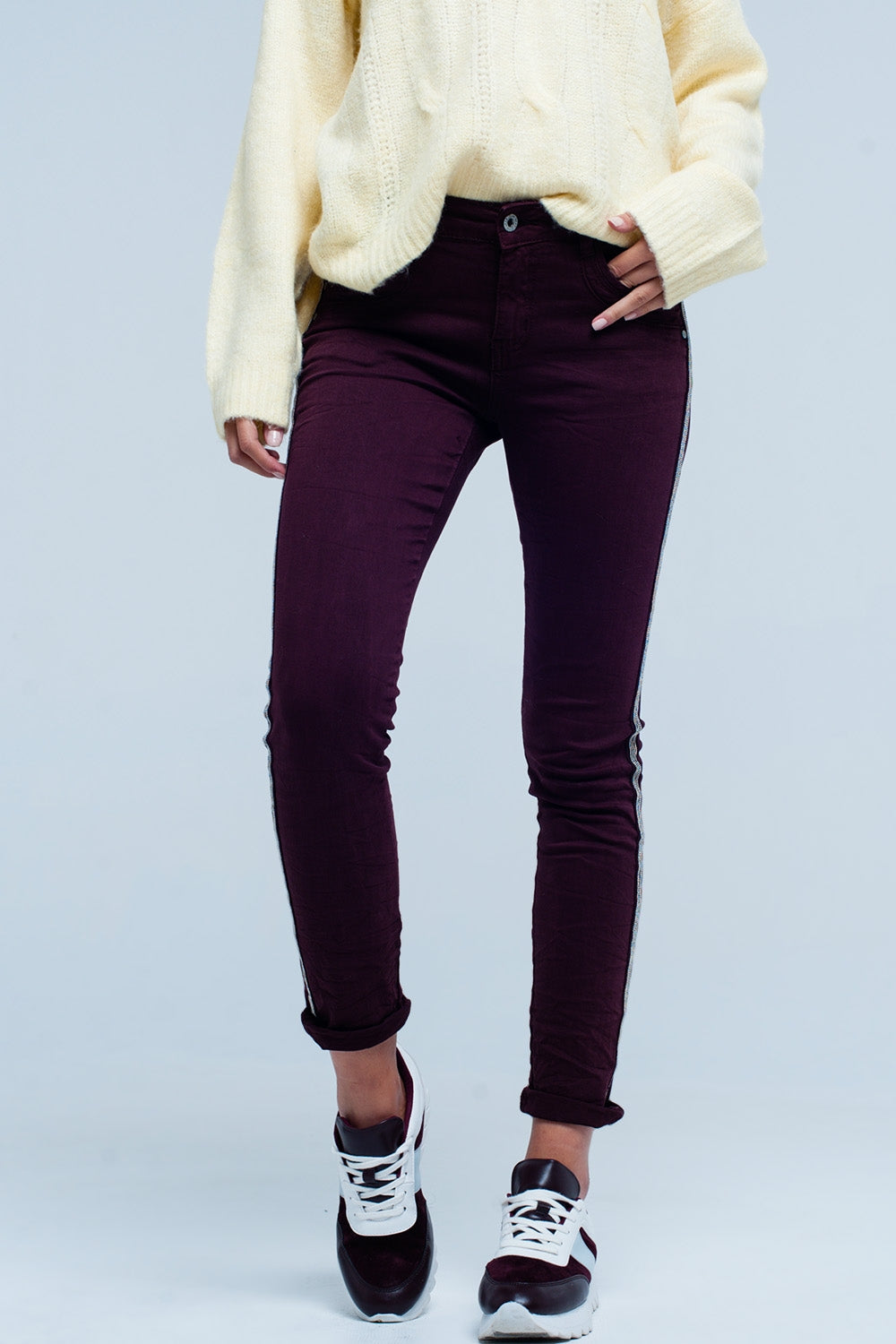 Jeans skinny con riga laterale metallizzata