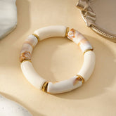 Bracciale Elastico Bianco con Finitura Dorata