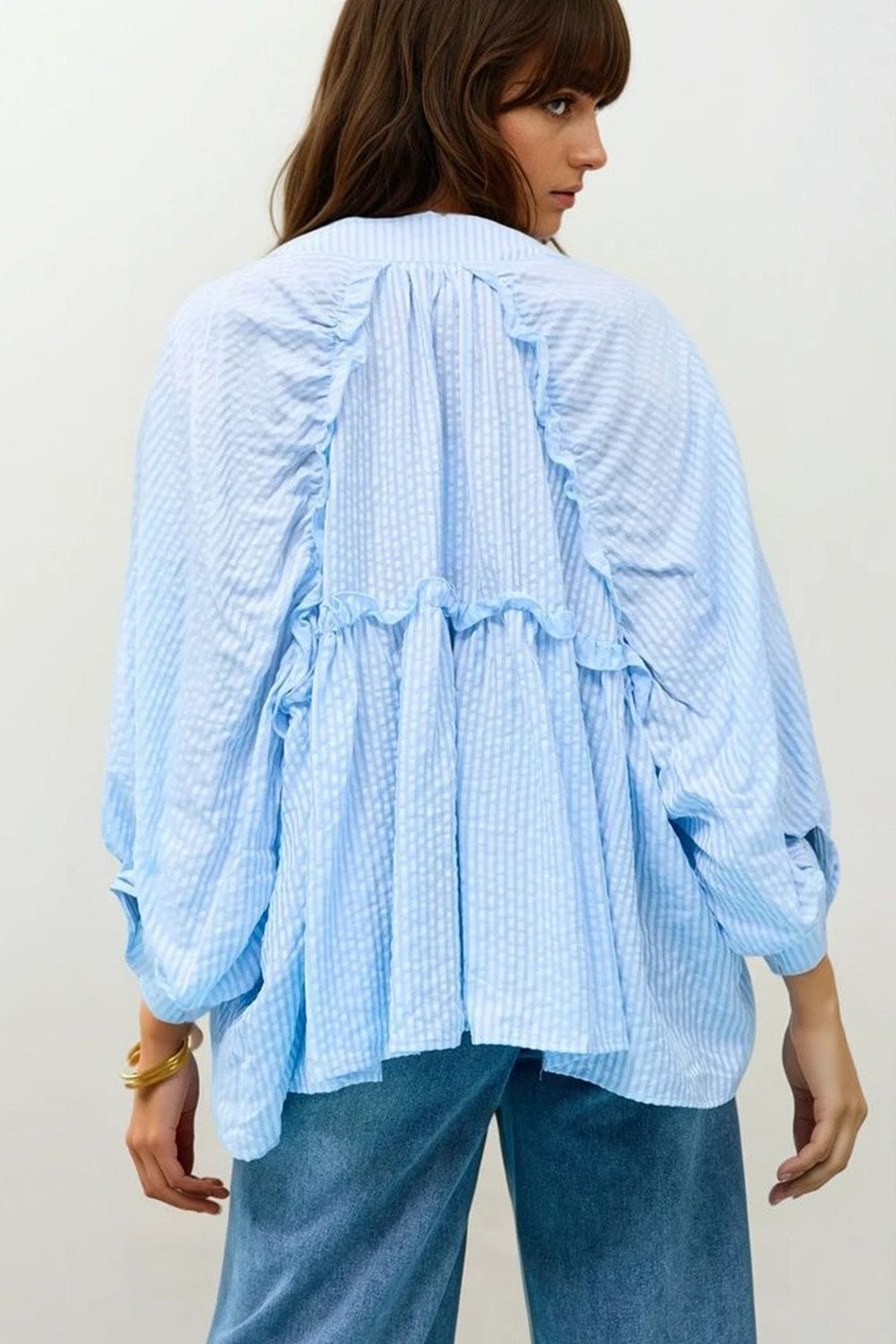 Blusa a righe con maniche a palloncino in azzurro