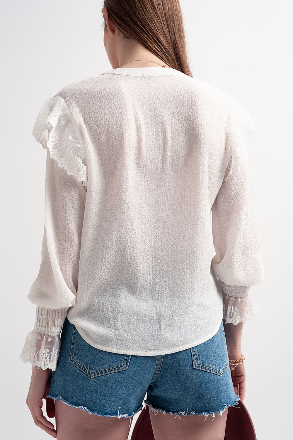 Blusa con maniche voluminose con polsini color ostrica