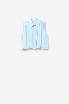 blusa in chiffon blu baby con pieghe sull'orlo