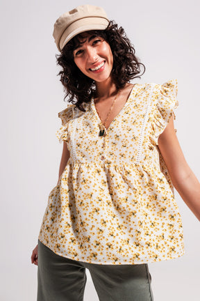 Q2 Blusa in giallo con volant e ricamo