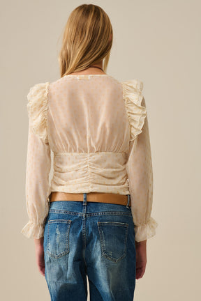 Camicetta beige con pois dorati e dettagli a balze