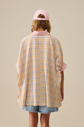 Camicetta fluida oversize con contrasto a scacchiera
