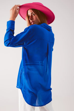 Camicia blu in chiffon trasparente