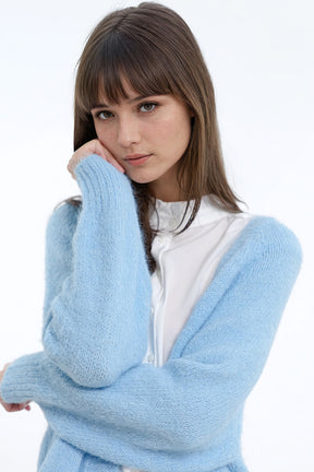 Cardigan aperto in maglia morbida e rilassata di colore blu baby con bordi e polsini a coste