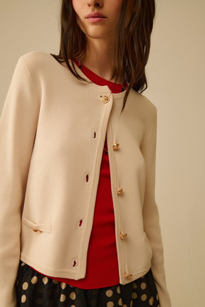 Cardigan beige con bottoni dorati