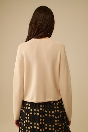 Cardigan beige con bottoni dorati