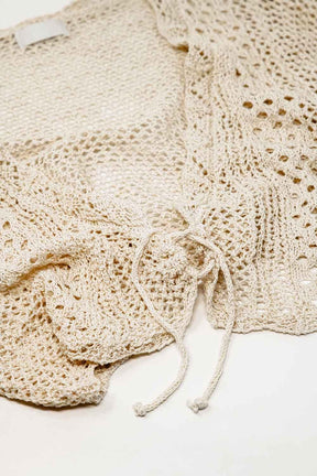 Cardigan cropped in beige con chiusura a cravatta