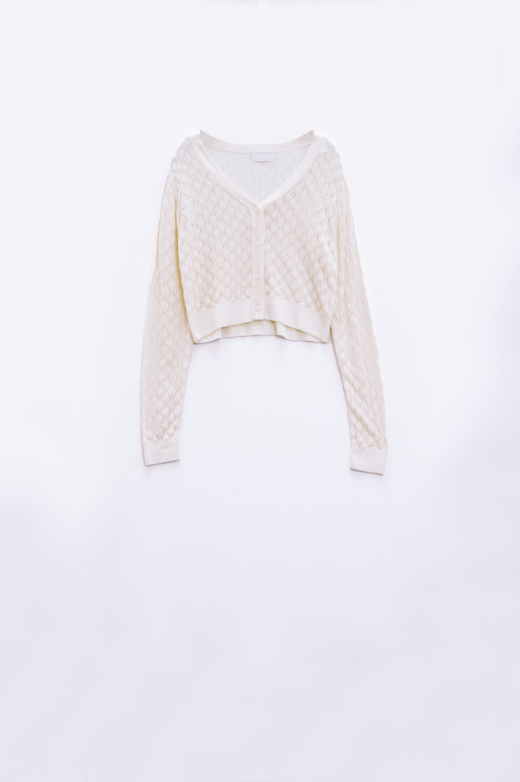 Cardigan cropped in beige con stampa argyle