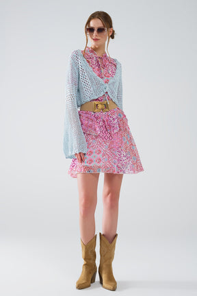 Cardigan cropped in blu baby con chiusura a cravatta