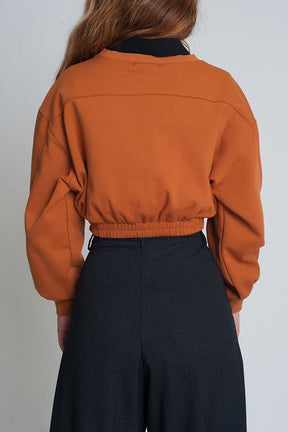 Felpa oversize tagliata in cammello
