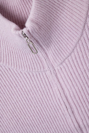 Gilet lavorato a maglia con collo alto a mezza zip e ampi giromanica in rosa