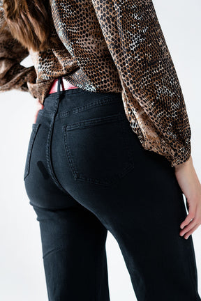 Jeans dritti con bottoni dorati ai lati in nero