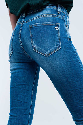 Jeans skinny blu con strappi