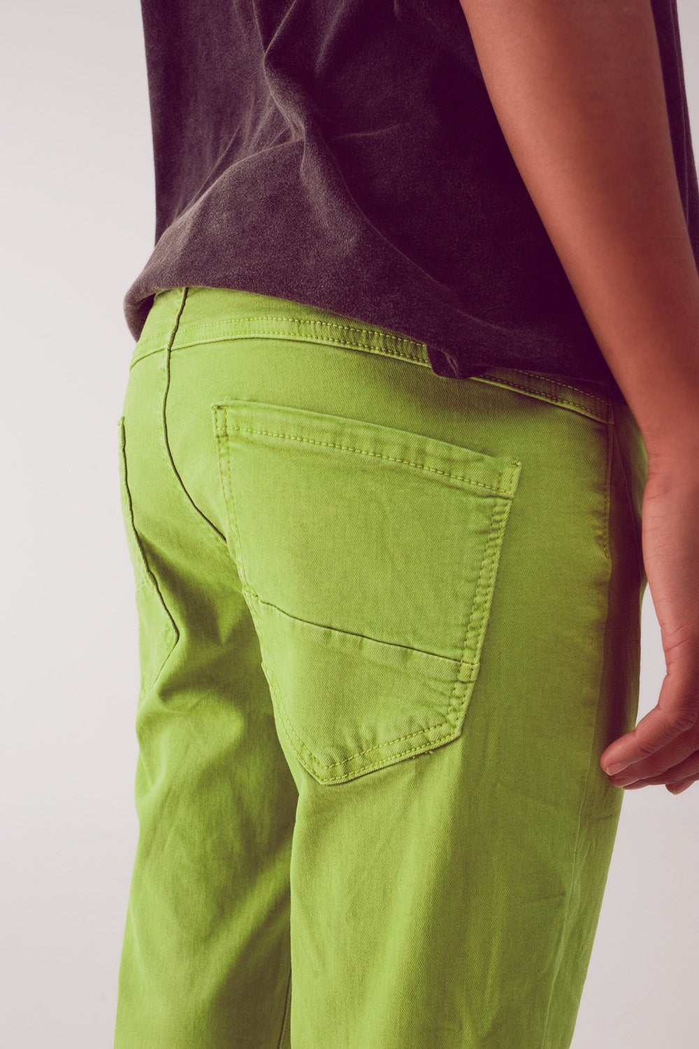 Jeans skinny con bottoni a vista e lavaggio verde
