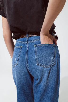 Jeans strappati a gamba dritta con bagliori metallici dorati