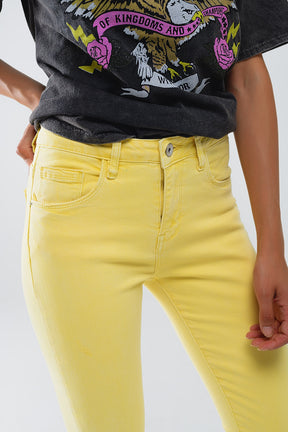 Jeans stretch super skinny gialli con orlo frastagliato