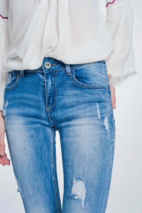 Jeans super skinny blu lavaggio vintage strappati