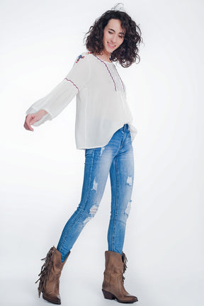 Jeans super skinny blu lavaggio vintage strappati