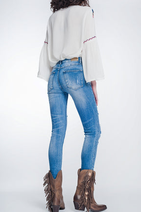 Jeans super skinny blu lavaggio vintage strappati