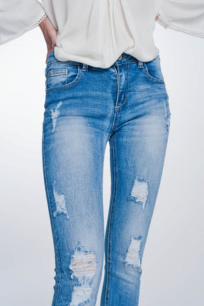 Jeans super skinny blu lavaggio vintage strappati