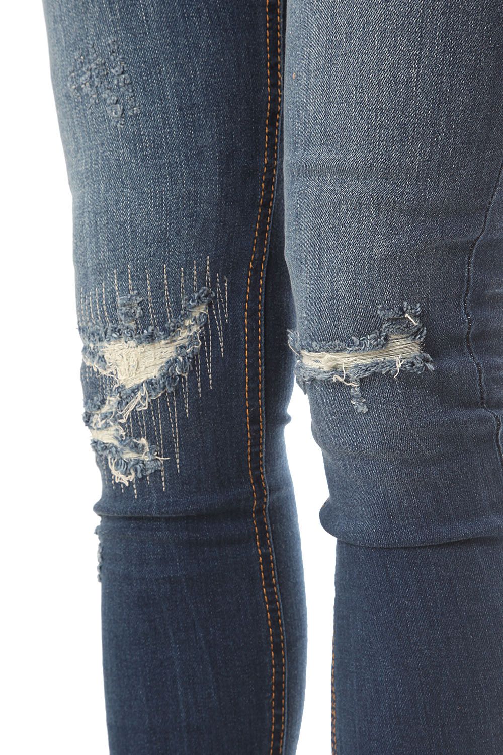 Jeans super slim con effetto strappati
