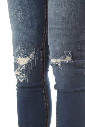 Jeans super slim con effetto strappati