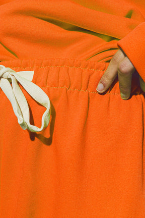 Jogger oversize con cravatta in vita in arancione brillante