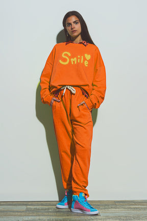 Jogger oversize con cravatta in vita in arancione brillante