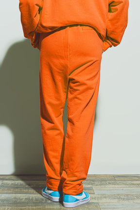 Jogger oversize con cravatta in vita in arancione brillante