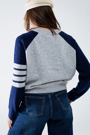 Maglia con maniche raglan bicolore in blu e grigio