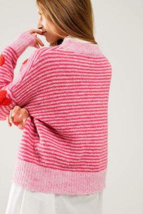 Maglione a righe rosa con cuori di colore rosso