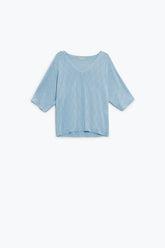 Q2 Maglione azzurro a maniche corte con motivo argyle