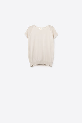 Maglione beige a maniche corte con maglia sulla spalla