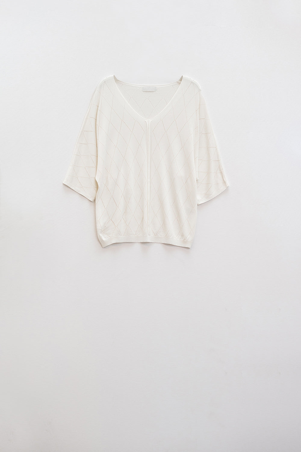 Q2 Maglione beige a maniche corte con motivo argyle