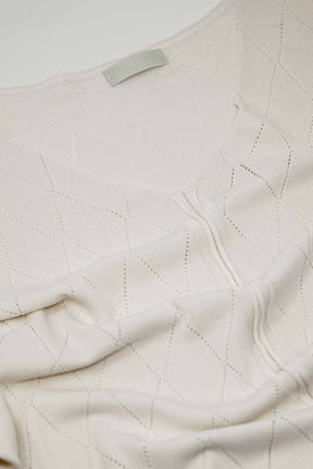 Maglione beige a maniche corte con motivo argyle