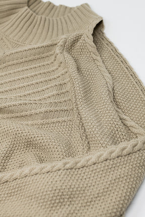 Maglione beige con design all'uncinetto e girocollo