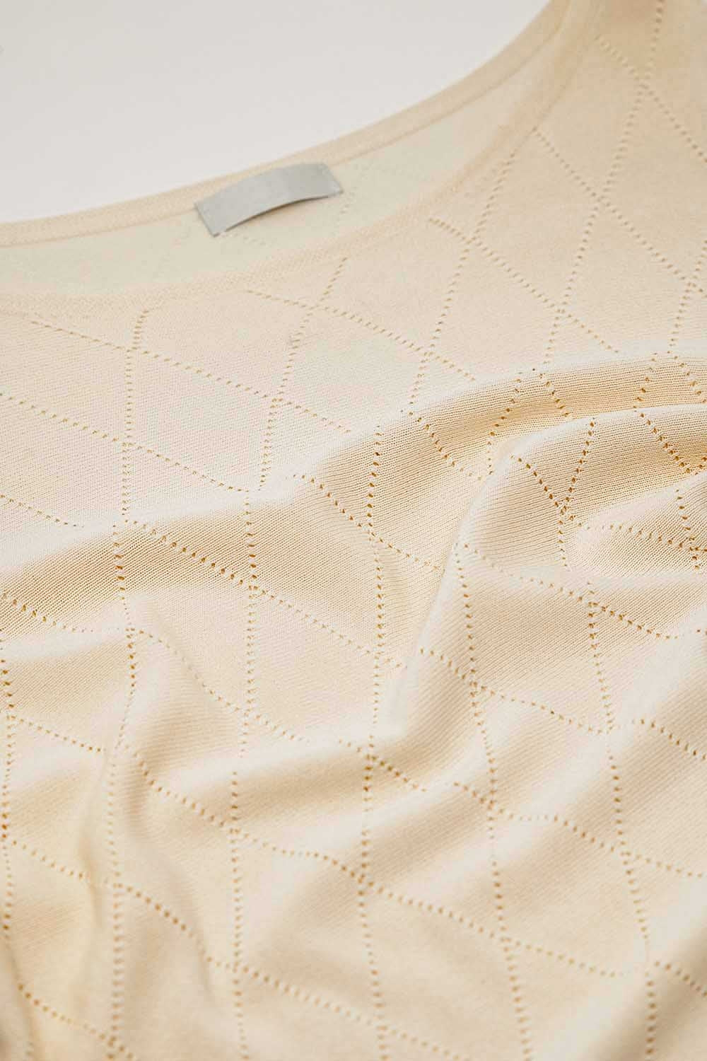 Maglione beige con stampa argyle e scollo a barca