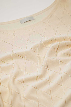 Maglione beige con stampa argyle e scollo a barca