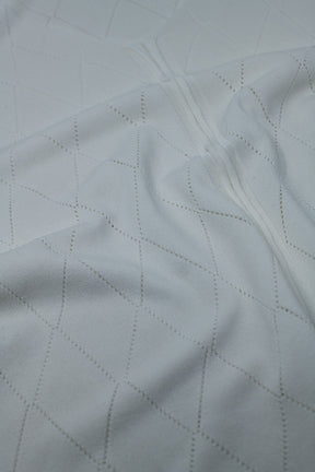 Maglione bianco a maniche corte con motivo argyle