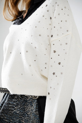 Maglione con scollo a V impreziosito da stelle metalliche