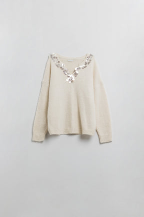 Maglione crema a V con dettaglio di paillettes