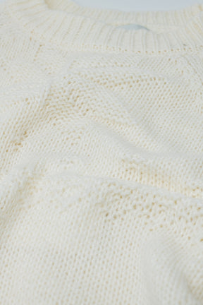 Maglione crema con dettagli natalizi