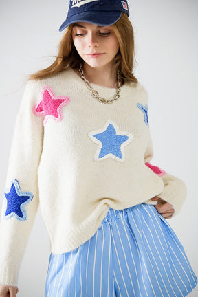 Maglione crema con stelle ricamate