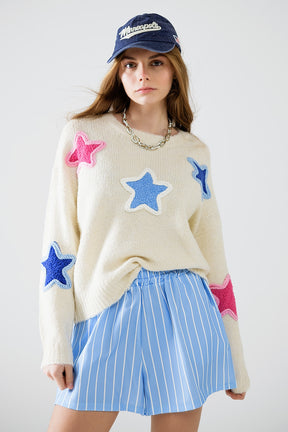 Maglione crema con stelle ricamate