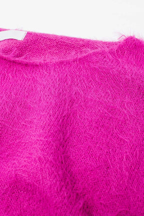 maglione cropped in fucsia aderente in vita