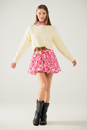 Maglione in maglia morbida color crema con motivo a cavi
