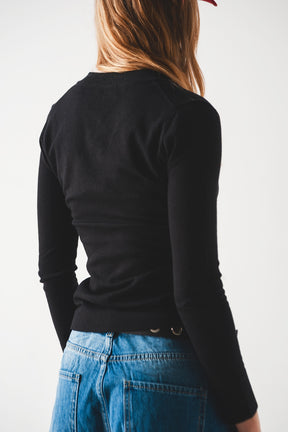 Maglione nero in maglia fine con scollo a V